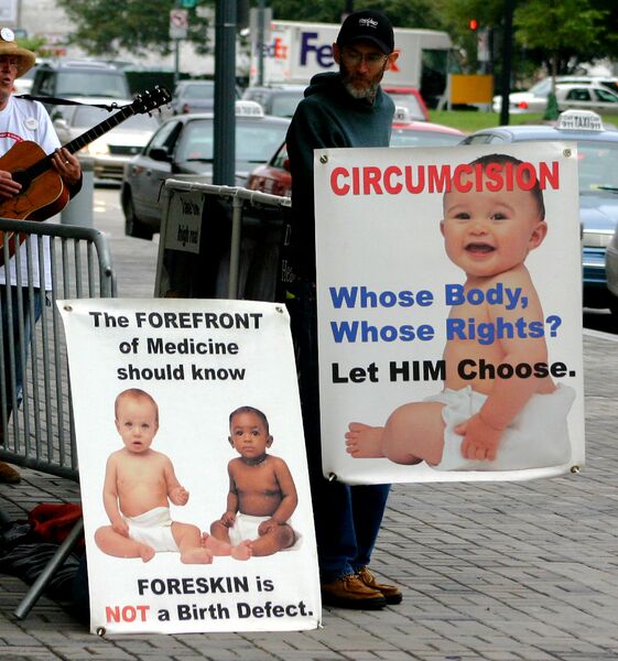Файл:Activist protesting infant circumcision.jpg