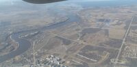 Река Великая впадает в Псковское озеро. Вид с самолёта со стороны города Пскова
