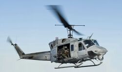 120131-N-XK513-120 Sailor directs a UH-1N Huey helicopter from (VMM) 261 (cropped).jpg
