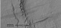 Слои горной породы в кратере, снимок орбитальной станции MRO