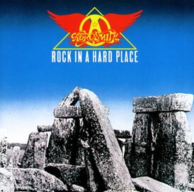 Обложка альбома Aerosmith «Rock in a Hard Place» (1982)