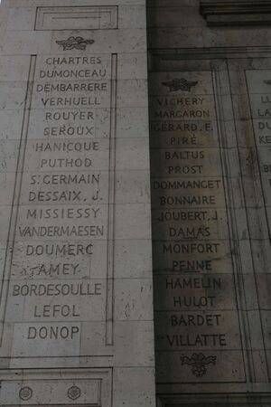 Photo of lists of names inscribed on stone under the Arc of Triumph.