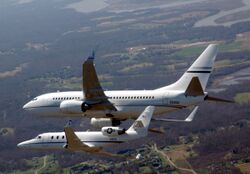 C-38A and C-40C DC ANG in flight.jpg