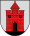 A coat of arms depicting a red castle with black double doors, two black windows, and one central tower all standing on black ground