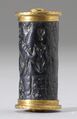 На этой цилиндрической печати с Кипра изображены две обнажённые женские фигуры. Каждая держит цветок, символ плодородия.[5] Художественный музей Уолтерс.