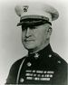 A black and white image of Douglas McDougal, a white male in his Marine Corps dress uniform