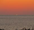 Зелёный луч при закате солнца 30 июня 2010 г. над морем на острове Гельголанд в Германии…