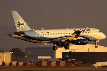 Interjet Sukhoi Superjet landing at Mexico City International Airport.jpg