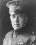 A black and white image of John Russell, a white male in his Marine Corps dress uniform