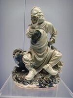Blue underglaze statue of a man with his pipe, Jingdezhen porcelain, Ming Wanli period (1573-1620)