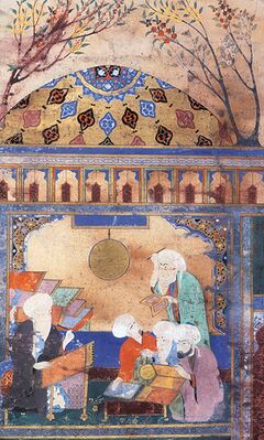 Насир ад-Дин Туси (сидит за столом) в Марагинской обсерватории. Миниатюра 1562 года. Британская библиотека