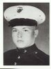 A black and white headshot of Paul facing slightly to the left and wearing his military dress blue uniform with hat.