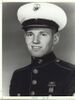 A black and white image showing Perkins head and upper torso in his military dress uniform with hat.