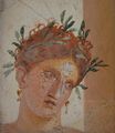 Римская фреска женщины с рыжими волосами в гирлянде из маслин, из Геркуланума, созданная до гибели города в 79 году н. э. при извержении вулкана Везувий (которое также уничтожило Помпеи)