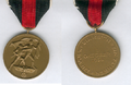 Медаль «В память 1 октября 1938 года». Слева - лицевая сторона, справа - оборотная сторона.