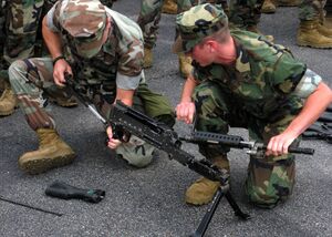 US Navy 091002-N-9261G-022 Seabees assigned to Naval Mobile Construction Battalion (NMCB) 133 assemble an M-240B machine gun during the Black Hell Squad.jpg