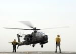 US Navy 110719-N-UT455-143 For the first time, an Apache helicopter lands on the deck of a U.S. Navy ship.jpg