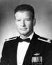 A black-and-white photo of an older white man in his military dress uniform