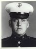 A black and white image showing the head and upper torso of Williams wearing his military dress uniform with hat.